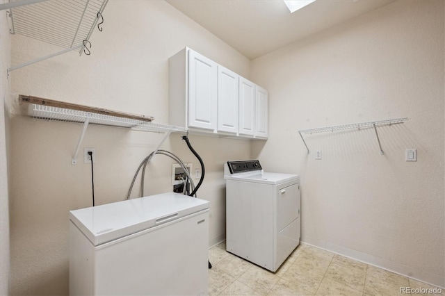10725 Eliot Cir Unit 102, Denver, CO 80234 - washroom with cabinet space, washer and dryer, and baseboards