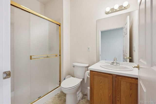 10725 Eliot Cir Unit 102, Denver, CO 80234 - bathroom featuring vanity, toilet, and a stall shower