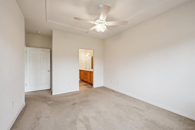 10725 Eliot Cir Unit 102, Denver, CO 80234 - unfurnished bedroom featuring light colored carpet, baseboards, ensuite bathroom, a ceiling fan, and attic access