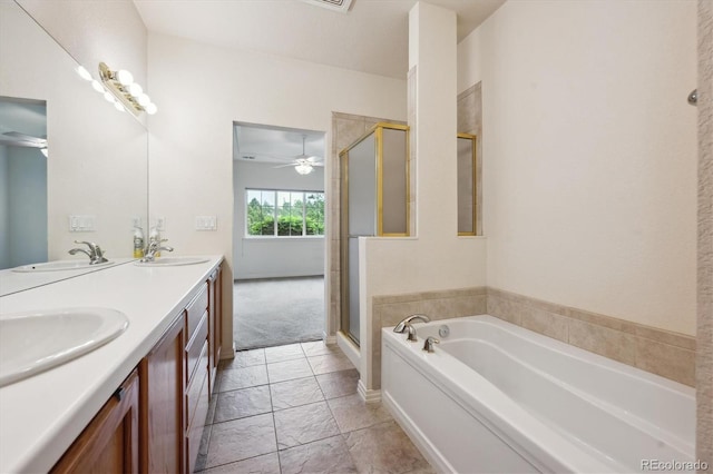 10725 Eliot Cir Unit 102, Denver, CO 80234 - full bath featuring a garden tub, a stall shower, double vanity, and ceiling fan