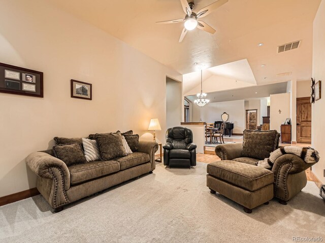 living area with baseboards, carpet floors, visible vents, lofted ceiling, and ceiling fan with notable chandelier