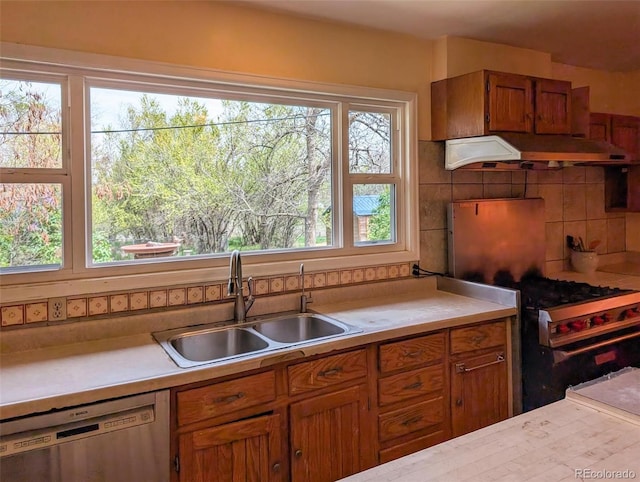 4586 N 95th St, Lafayette, CO 80026 - kitchen with dishwasher, custom range hood, light countertops, and brown cabinetry