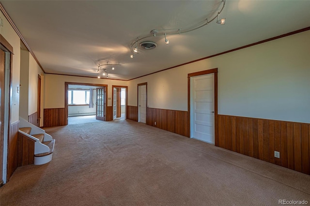 4586 N 95th St, Lafayette, CO 80026 - empty room featuring a wainscoted wall, wooden walls, carpet flooring, ornamental molding, and stairway