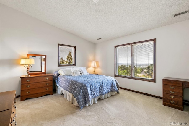 4 Pine Rd, Colorado Springs, CO 80906 - carpeted bedroom featuring a textured ceiling, baseboards, and vaulted ceiling