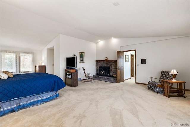 4 Pine Rd, Colorado Springs, CO 80906 - bedroom featuring lofted ceiling, light carpet, a stone fireplace, and baseboards