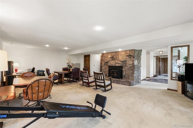 4 Pine Rd, Colorado Springs, CO 80906 - exercise area with light colored carpet, a stone fireplace, and recessed lighting