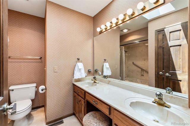 4 Pine Rd, Colorado Springs, CO 80906 - bathroom with toilet, double vanity, and a shower