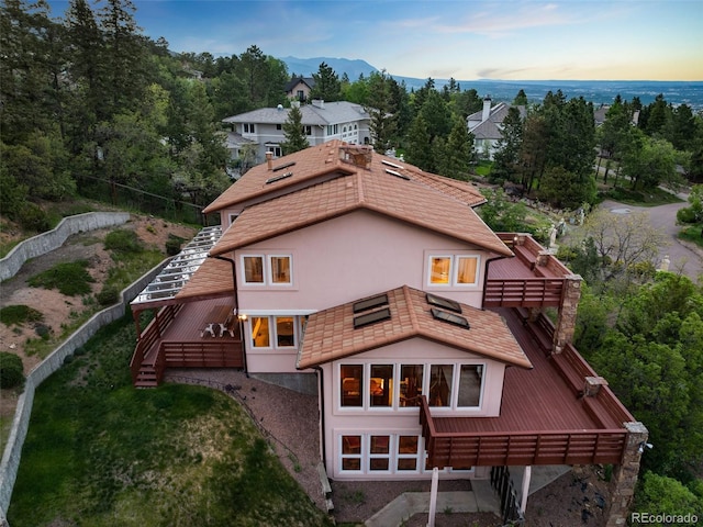 4 Pine Rd, Colorado Springs, CO 80906 - back of property with stucco siding and stairway