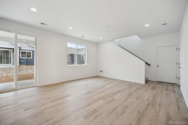 unfurnished living room with light wood-type flooring