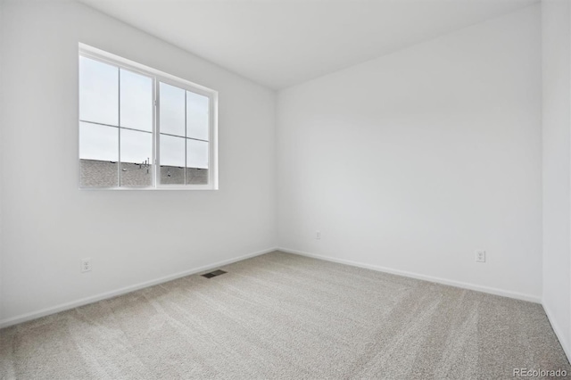 spare room with carpet floors