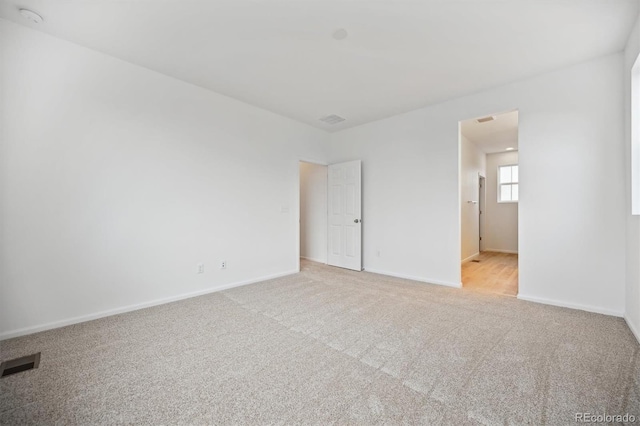 unfurnished bedroom with light colored carpet