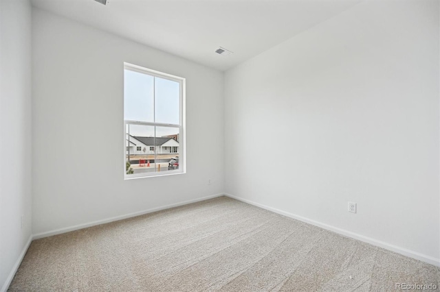 unfurnished room with carpet flooring