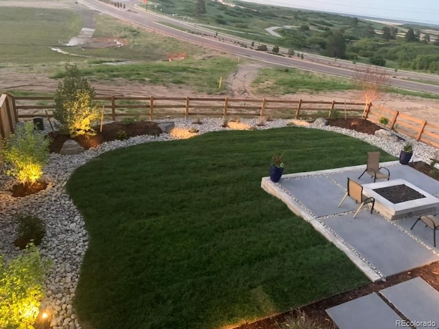 view of yard featuring a rural view and a patio area