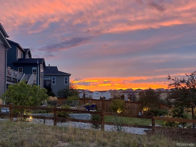 view of yard at dusk