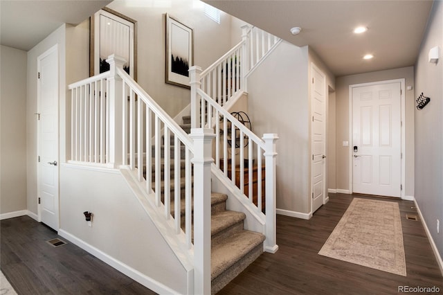 stairway featuring hardwood / wood-style floors