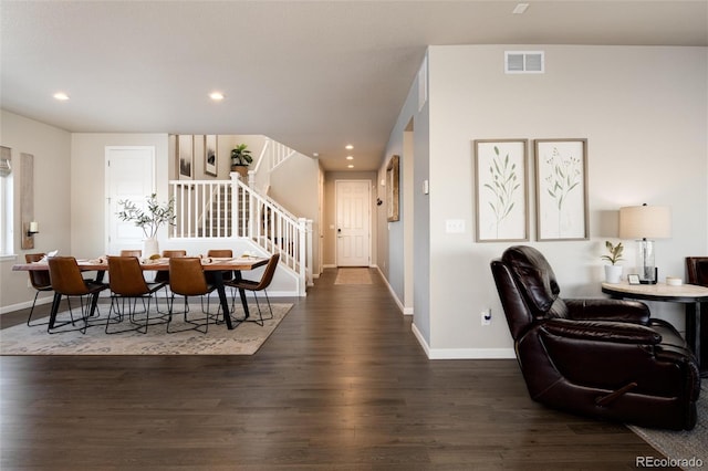 dining area with dark hardwood / wood-style floors