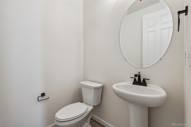 bathroom with toilet and sink