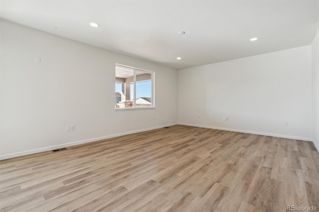 empty room featuring light hardwood / wood-style floors