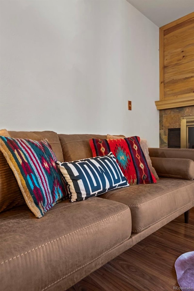 living room featuring wood finished floors and a fireplace