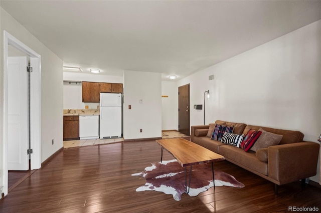 living room featuring wood finished floors and baseboards