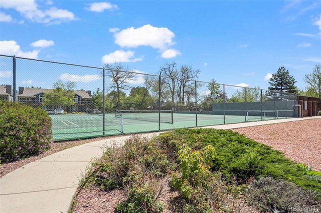view of tennis court with fence