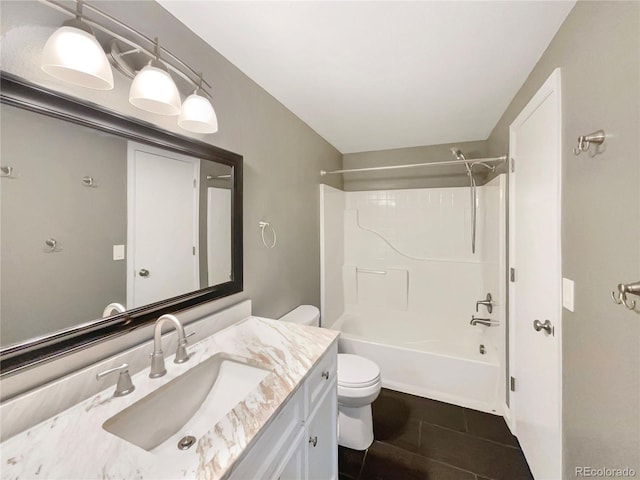 full bathroom with shower / tub combination, vanity, tile patterned floors, and toilet