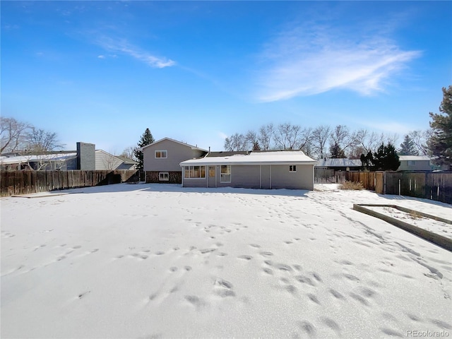 view of snow covered property