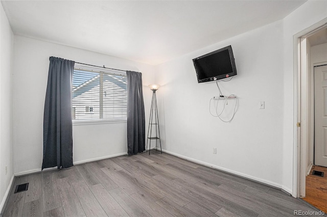 4220 E 119th Pl Unit A, Thornton, CO 80233 - unfurnished bedroom featuring wood finished floors and baseboards