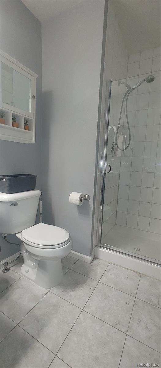 4220 E 119th Pl Unit A, Thornton, CO 80233 - full bath featuring a stall shower and tile patterned flooring