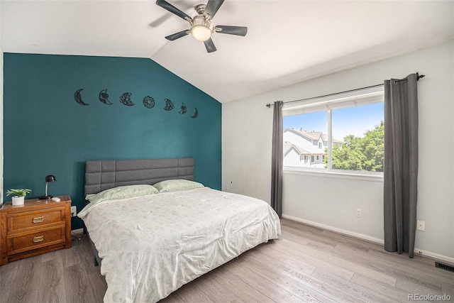 4220 E 119th Pl Unit A, Thornton, CO 80233 - bedroom with lofted ceiling, wood finished floors, and a ceiling fan