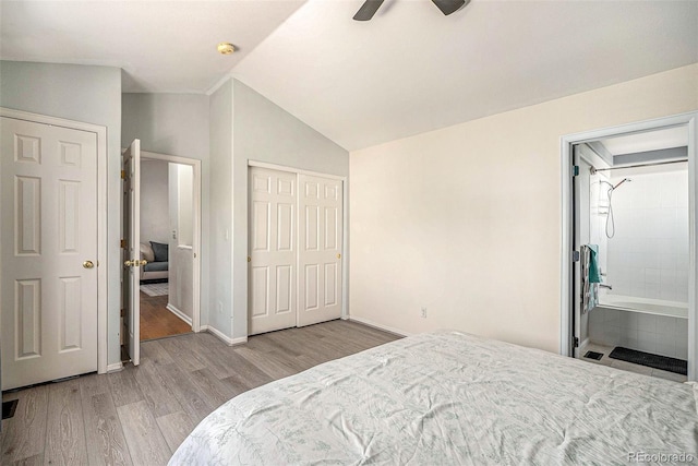4220 E 119th Pl Unit A, Thornton, CO 80233 - bedroom featuring wood finished floors, vaulted ceiling, ensuite bathroom, and ceiling fan