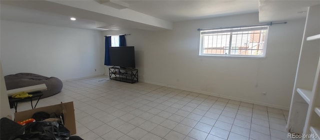 4220 E 119th Pl Unit A, Thornton, CO 80233 - unfurnished living room with plenty of natural light and light tile patterned flooring