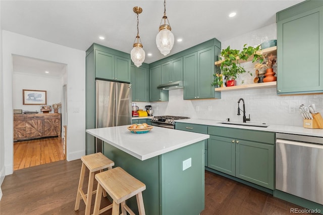 3059 N Humboldt St, Denver, CO 80205 - kitchen with stainless steel appliances, a sink, decorative backsplash, green cabinetry, and recessed lighting