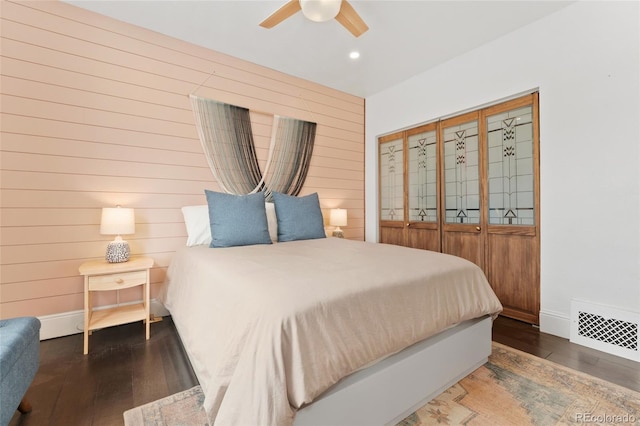 3059 N Humboldt St, Denver, CO 80205 - bedroom featuring hardwood / wood-style floors, wooden walls, recessed lighting, a ceiling fan, and baseboards
