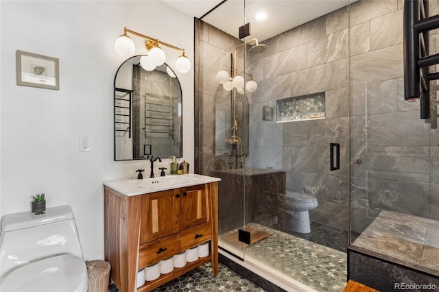 3059 N Humboldt St, Denver, CO 80205 - bathroom with toilet, a stall shower, and vanity