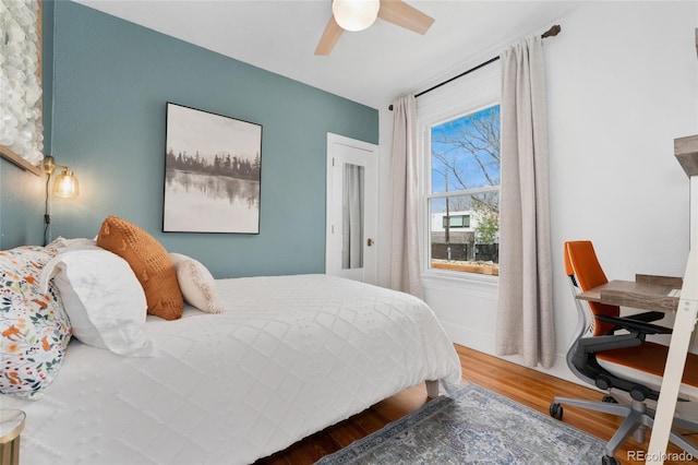 3059 N Humboldt St, Denver, CO 80205 - bedroom featuring wood finished floors and a ceiling fan