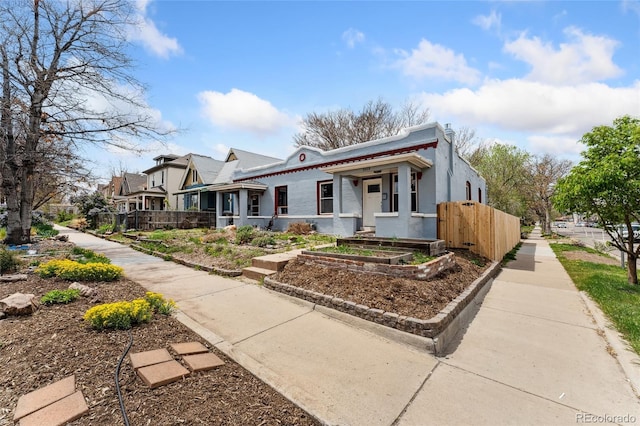 3059 N Humboldt St, Denver, CO 80205 - view of front of property featuring fence and a garden