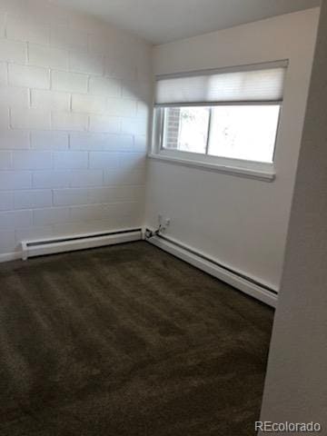 unfurnished room with a baseboard radiator