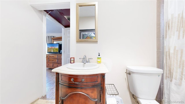 66095 E Kettle Pl, Byers, CO 80103 - bathroom with vanity, toilet, and a shower with curtain