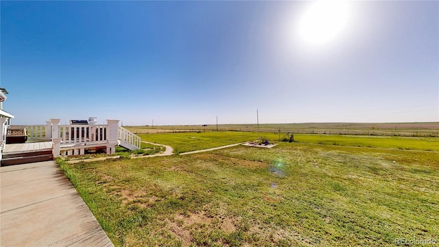 66095 E Kettle Pl, Byers, CO 80103 - view of green lawn featuring a view of rural / pastoral area and a deck