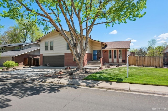 3832 S Quebec St, Denver, CO 80237 - view of front of house featuring brick siding, concrete driveway, and a garage