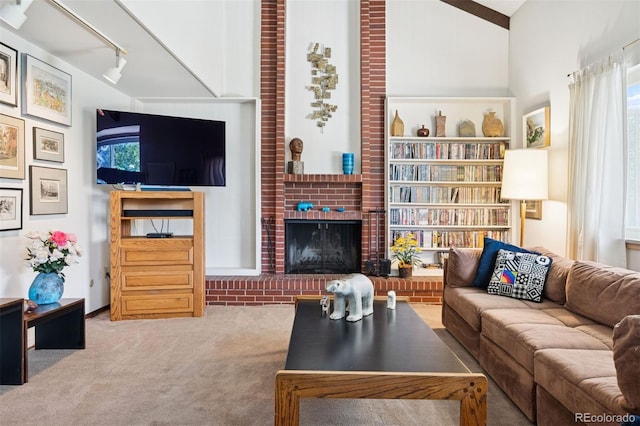 3832 S Quebec St, Denver, CO 80237 - carpeted living room with a brick fireplace and lofted ceiling
