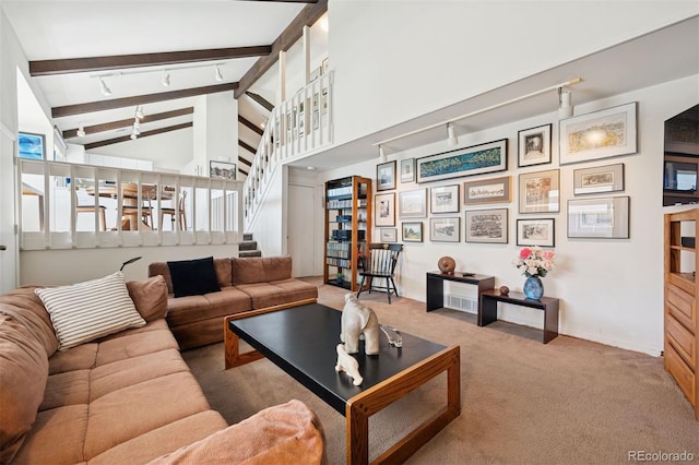 3832 S Quebec St, Denver, CO 80237 - living area with rail lighting, carpet floors, beamed ceiling, stairs, and high vaulted ceiling
