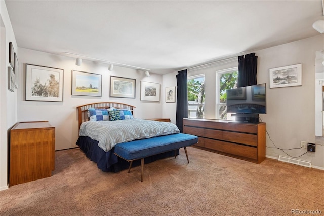 3832 S Quebec St, Denver, CO 80237 - carpeted bedroom featuring track lighting and baseboards