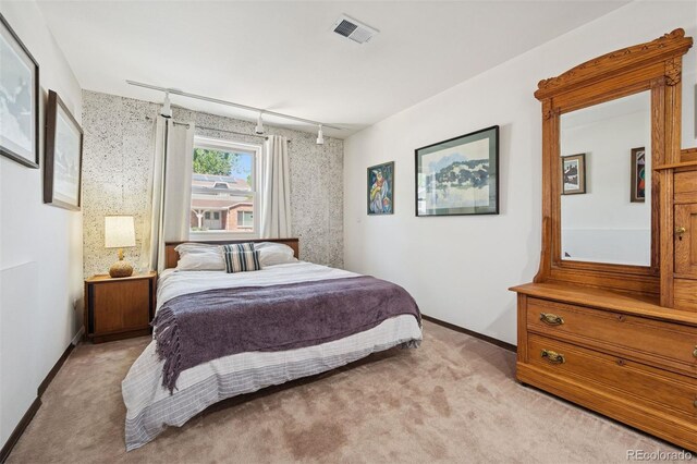 3832 S Quebec St, Denver, CO 80237 - bedroom with light colored carpet, track lighting, and baseboards
