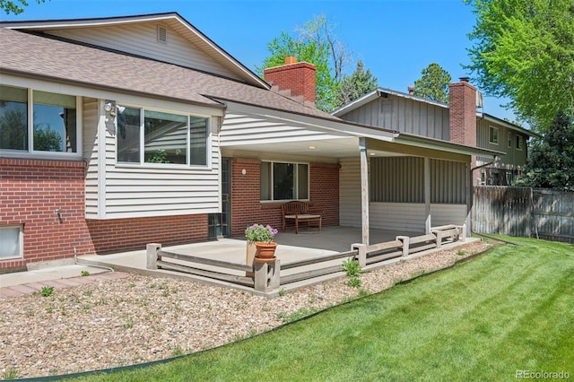 3832 S Quebec St, Denver, CO 80237 - rear view of property with brick siding, a patio area, roof with shingles, and a chimney