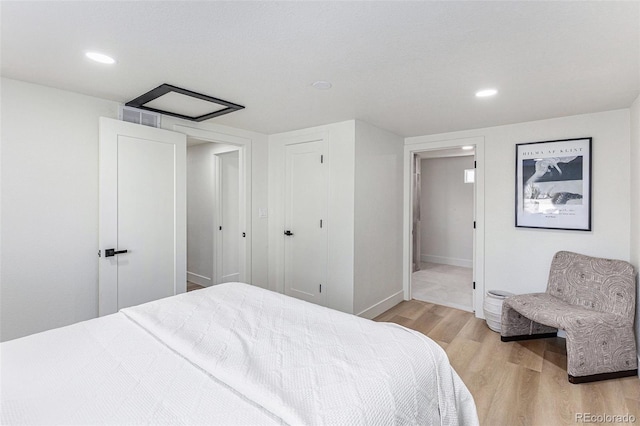 3800 W Eisenhower Blvd, Loveland, CO 80537 - bedroom with recessed lighting, light wood-style floors, baseboards, and visible vents