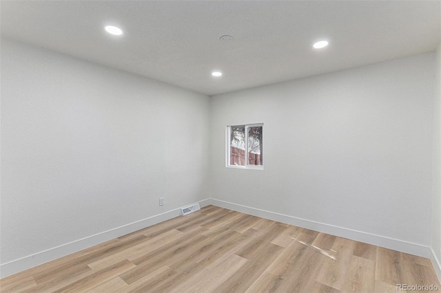 3800 W Eisenhower Blvd, Loveland, CO 80537 - empty room with light wood finished floors, baseboards, visible vents, and recessed lighting