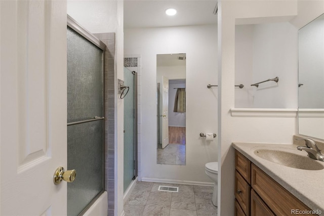 bathroom with visible vents, toilet, marble finish floor, an enclosed shower, and vanity