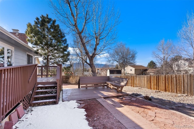 view of yard featuring fence and a wooden deck